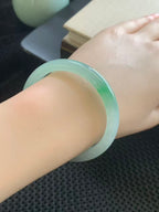 Ice-grade Jadeite Bangle with Floating Green